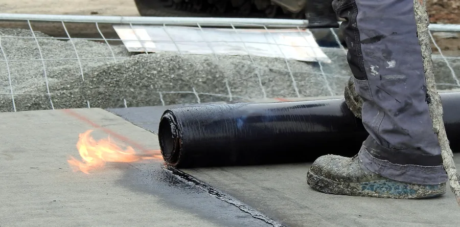 Modified Bitumen Roofing being installed for flat roof