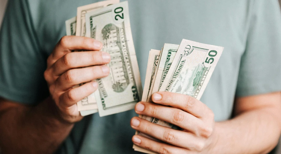 man counting money