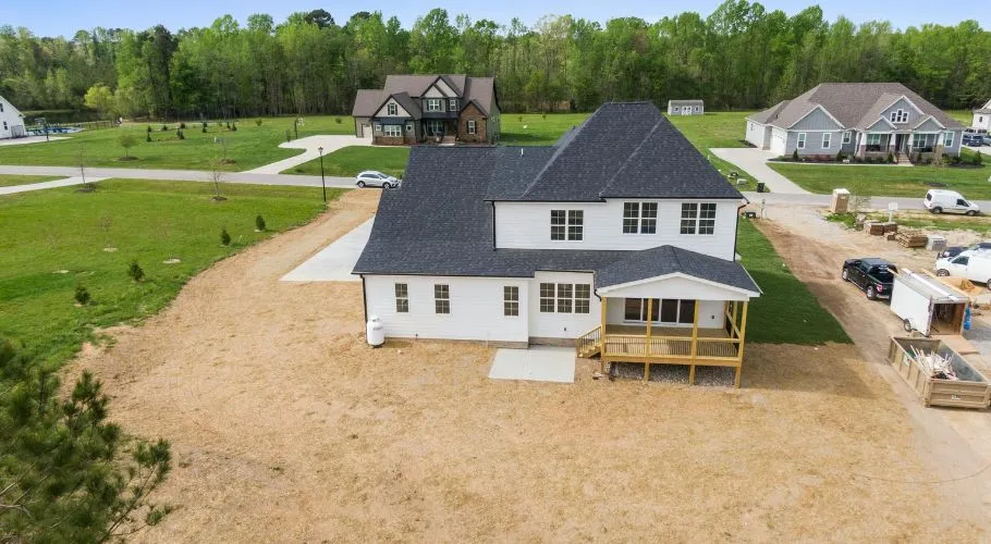 clean landscape surrounding house after a roofing project
