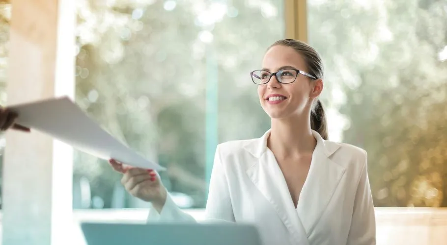 woman handing over a quote
