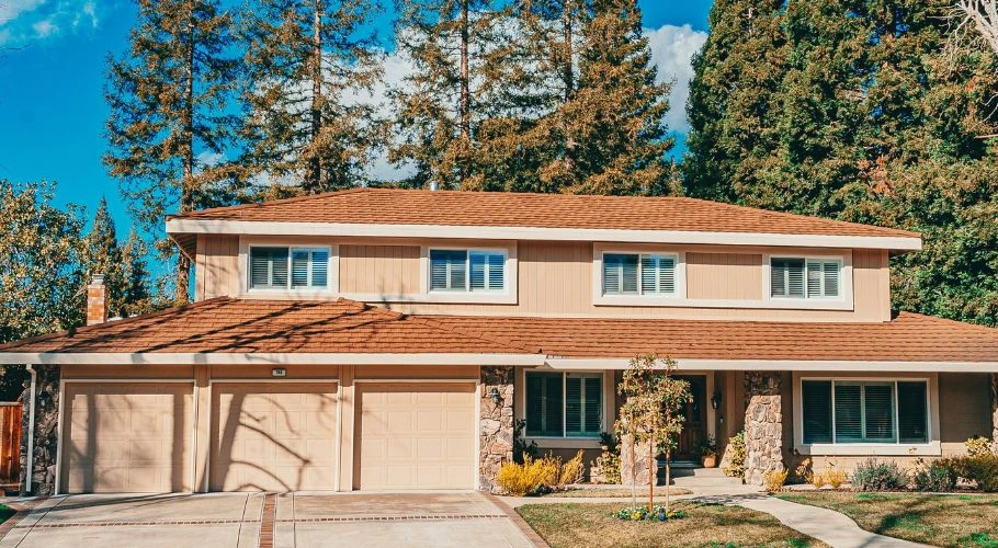 A house painted with brown and peach:beige paint.