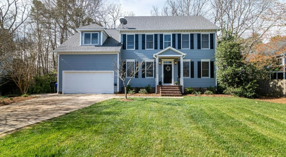 Large house with white, gray, and light blue color palette.