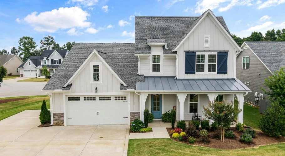 Visually-appealing home with a roof overhang.