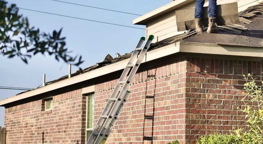 Ladder leaning on the side of a house.
