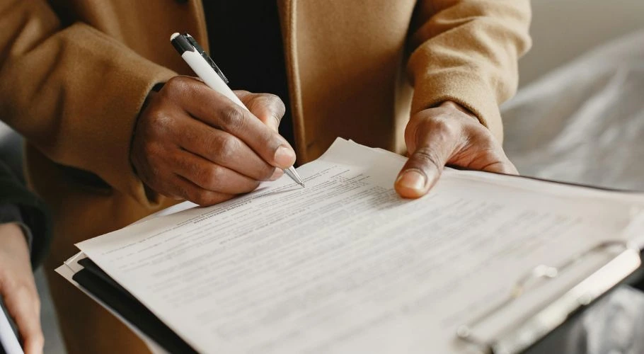 Reading and signing a contract.