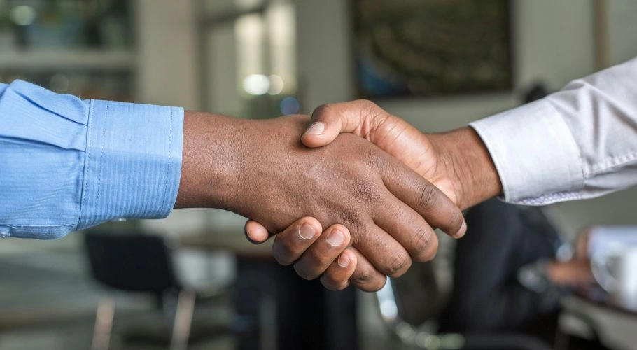 Shaking hands with local contractors.