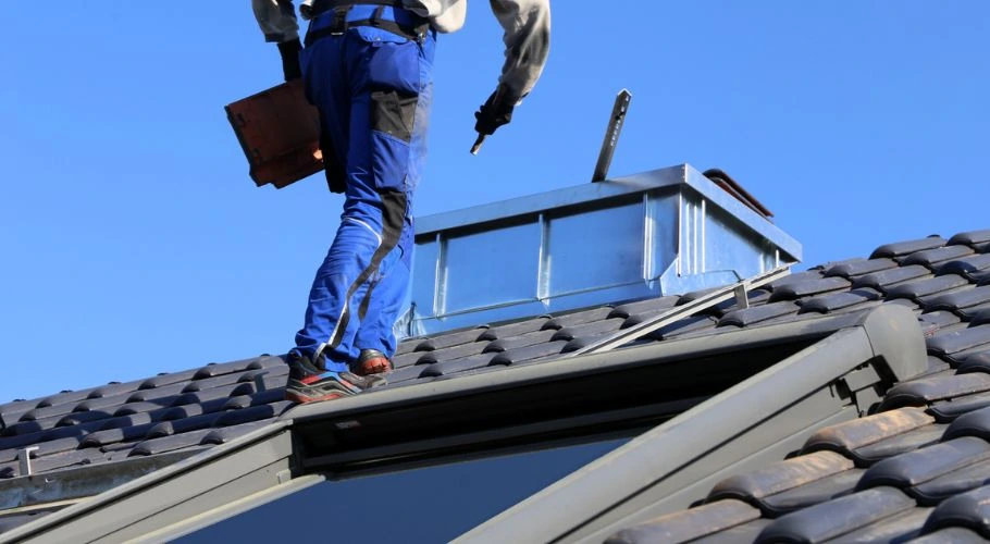 man checking roofing material warranty