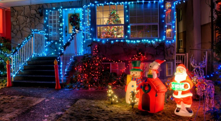 House with colorful Christmas lights and decorations.
