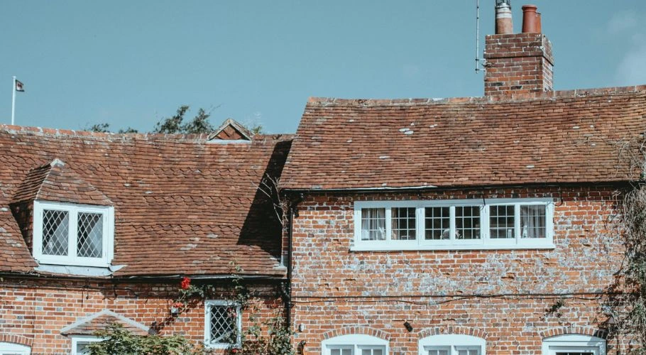 Old, traditional house against a blue sky.