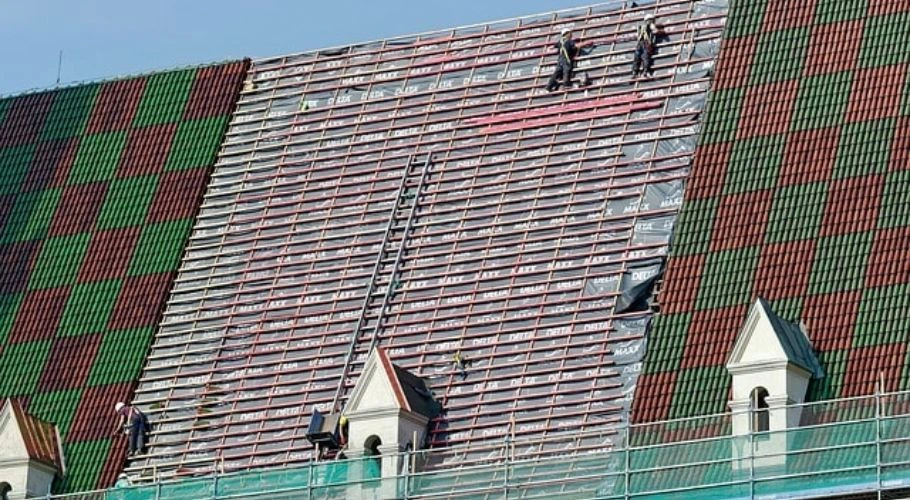 Roofers working on a roofing project.