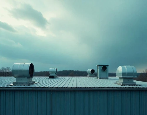 a flat roof showcasing various ventilation systems
