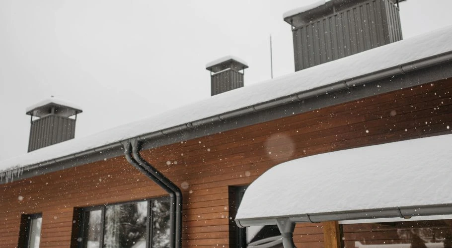 snow on a roof during winter