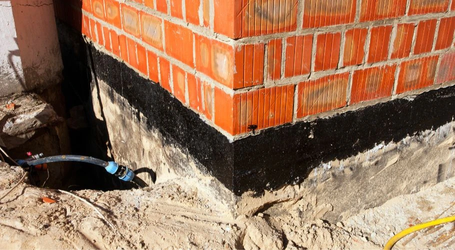 damages foundation from debris buildup and water damage in gutters