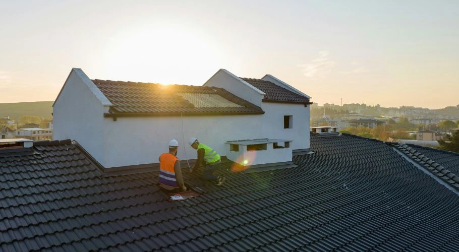professionals upgrading roof vents